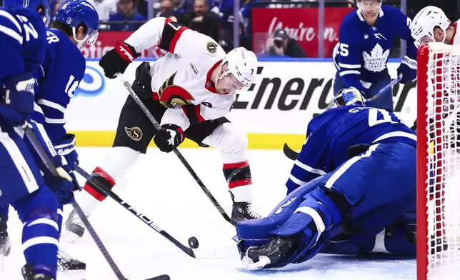 Ottawa Senators Brady Tkachuk (7) takes a shot on net against Toronto Maple Leafs goaltender Anthony Stolarz (41) during first period of NHL playoff action in Toronto on Tuesday, April 22, 2025. (Cole Burston/The Canadian Press via AP)