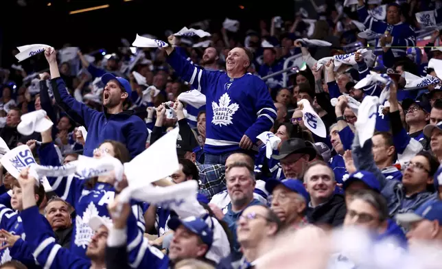 Toronto Maple Leafs fans cheer as they take on the Ottawa Senators during second period NHL playoff action in Toronto, on Tuesday, April 22, 2025. (Cole Burston/The Canadian Press via AP)