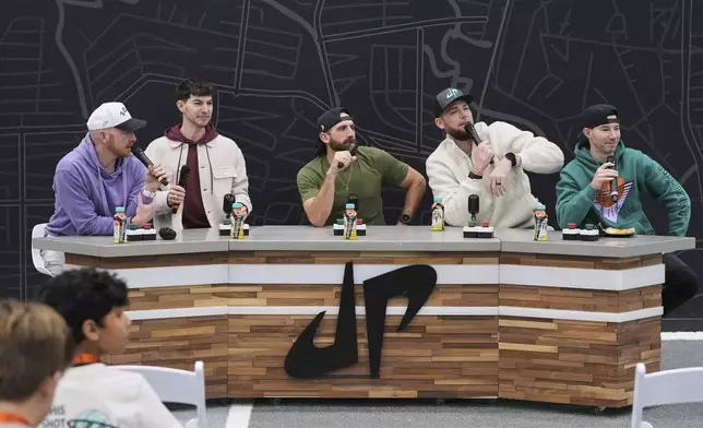 From left, Garrett Hilbert, Coby Cotton, Tyler Toney, Cody Jones and Cory Cotton, the founding members of Dude Perfect, speak during an event at their new headquarters in Frisco, Texas, Wednesday, Feb. 19, 2025. (AP Photo/Tony Gutierrez)