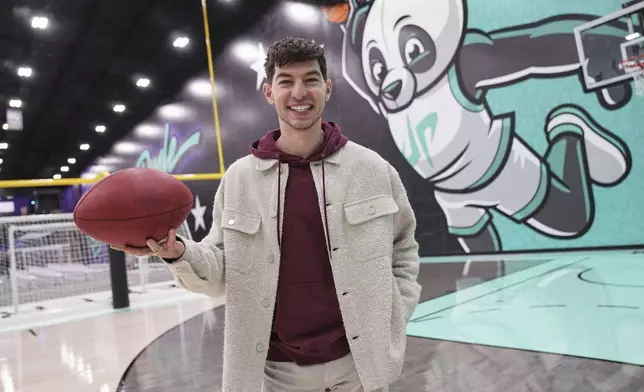 Dude Perfect member Coby Cotton poses for a photo while being interviewed at the their new headquarters in Frisco, Texas, Wednesday, Feb. 19, 2025. (AP Photo/Tony Gutierrez)
