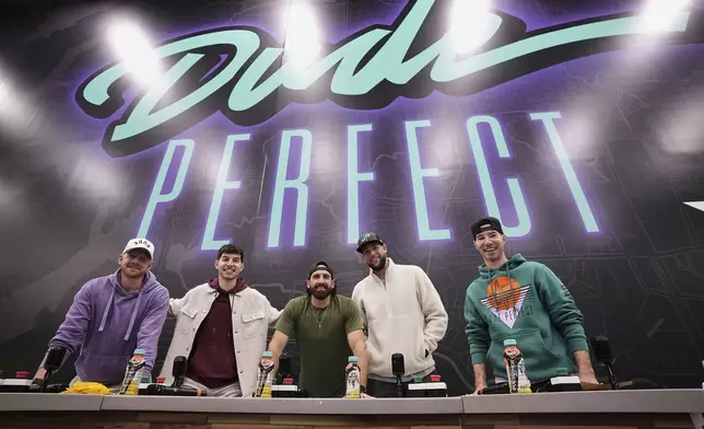From left, Garrett Hilbert, Coby Cotton, Tyler Toney, Cody Jones and Cory Cotton, the founding members of Dude Perfect, pose for a photo during an event at their new headquarters in Frisco, Texas, Wednesday, Feb. 19, 2025. (AP Photo/Tony Gutierrez)