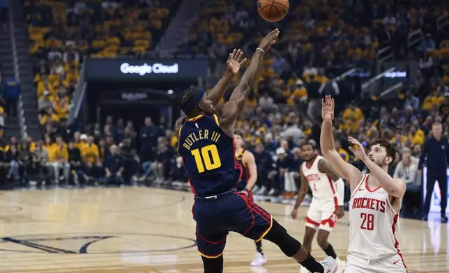 Golden State Warriors forward Jimmy Butler III (10) shoots over Houston Rockets center Alperen Sengun (28) during the first half of Game 4 of an NBA basketball first-round playoff series Monday, April 28, 2025, in San Francisco. (AP Photo/Godofredo A. Vásquez)