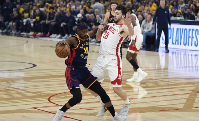 Golden State Warriors forward Jimmy Butler III (10) moves the ball while defended by Houston Rockets center Alperen Sengun (28) during the first half of Game 4 of an NBA basketball first-round playoff series Monday, April 28, 2025, in San Francisco. (AP Photo/Godofredo A. Vásquez)