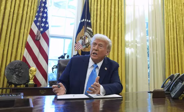 FILE - President Donald Trump speaks to reporters as he signs executive orders in the White House, Feb. 4, 2025, in Washington. (AP Photo/Evan Vucci, File)