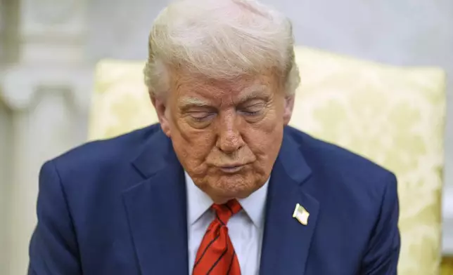 President Donald Trump listens as he meets with Italy's Prime Minister Giorgia Meloni in the Oval Office of the White House, Thursday, April 17, 2025, in Washington. (AP Photo/Alex Brandon)