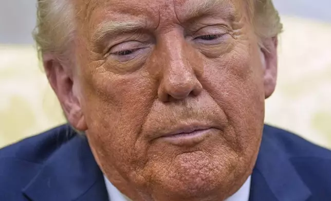 President Donald Trump listens as he meets with Italy's Prime Minister Giorgia Meloni in the Oval Office of the White House, Thursday, April 17, 2025, in Washington. (AP Photo/Alex Brandon)