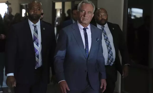 U.S. Health Secretary Robert F. Kennedy Jr. tours the Native Health Mesa Food Distribution Center in Mesa, Ariz., Tuesday, April 8, 2025. (AP Photo/Ross D. Franklin)