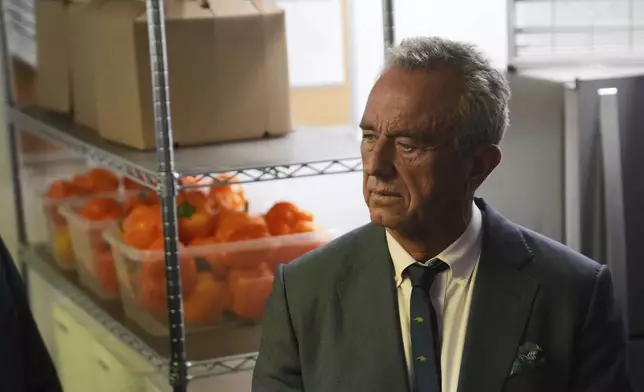 U.S. Health Secretary Robert F. Kennedy Jr. tours the Native Health Mesa Food Distribution Center in Mesa, Ariz., Tuesday, April 8, 2025. (AP Photo/Ross D. Franklin)
