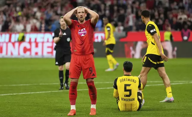 Bayern's Harry Kane reacts after the German Bundesliga soccer match between Bayern Munich and Borussia Dortmund at the Allianz Arena in Munich, Germany, Saturday, April 12, 2025. (AP Photo/Matthias Schrader)