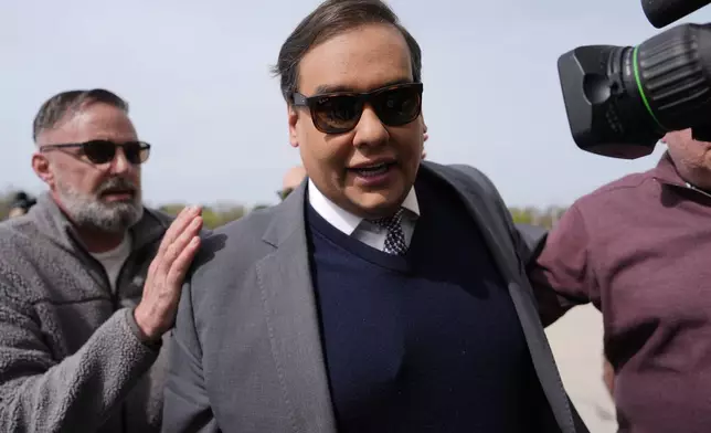 Former U.S. Rep. George Santos arrives at federal court for sentencing, Friday, April 25, 2025, in Central Islip, N.Y. (AP Photo/Julia Demaree Nikhinson)