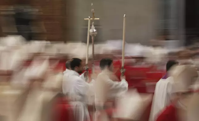 Clerics attend a mass on the third of nine days of mourning for late Pope Francis, in St. Peter's Basilica at the Vatican, Monday, April 28, 2025. (AP Photo/Andrew Medichini)