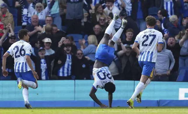 Brighton and Hove Albion's Carlos Baleba, center, celebrates scoring during the English Premier League soccer match between Brighton &amp; Hove Albion and West Ham United at the American Express Stadium, Brighton, England, Saturday April 26, 2025. (John Walton/PA via AP)