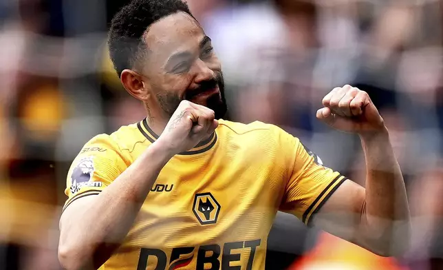 Wolverhampton Wanderers' Matheus Cunha celebrates after scoring their side's first goal during the English Premier League soccer match between Wolverhampton Wanderers and Leicester City at Molineux Stadium, Wolverhampton, England, Saturday, April 26, 2025. (Jacob King/PA via AP)