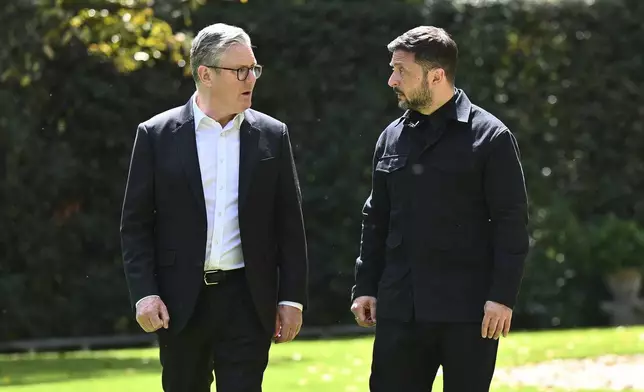 Britain's Prime Minister Keir Starmer, left, and President of Ukraine Volodymyr Zelenskyy walk through the gardens at The Villa Wolkonsky in Rome, Italy, during a bilateral meeting, Saturday April 26, 2025. (Marco M. Mantovani/Getty Images)