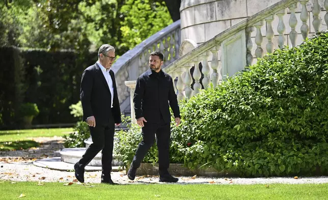 Britain's Prime Minister Keir Starmer, left, and President of Ukraine Volodymyr Zelenskyy walk through the gardens at The Villa Wolkonsky in Rome, Italy, during a bilateral meeting, Saturday April 26, 2025. (Marco M. Mantovani/Getty Images)