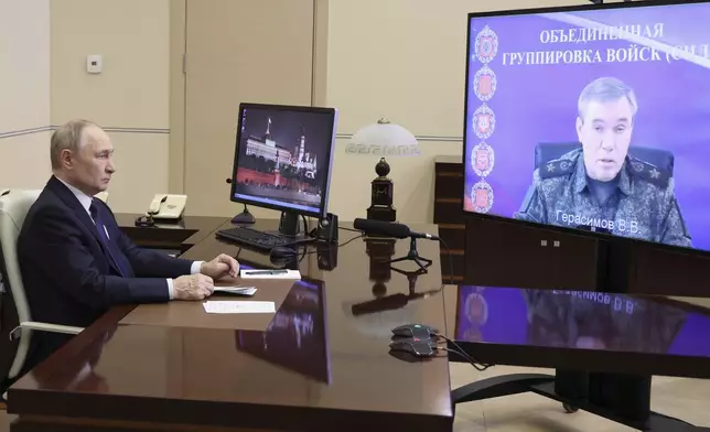 Russian President Vladimir Putin listens to Russian Chief of General Staff Gen. Valery Gerasimov with the report that all Ukrainian troops have been forced from Russia's Kursk region, during their meeting via videoconference at the Novo-Ogaryovo residence outside Moscow, Russia, Saturday, April 26, 2025. (Alexander Kazakov, Sputnik, Kremlin Pool Photo via AP)