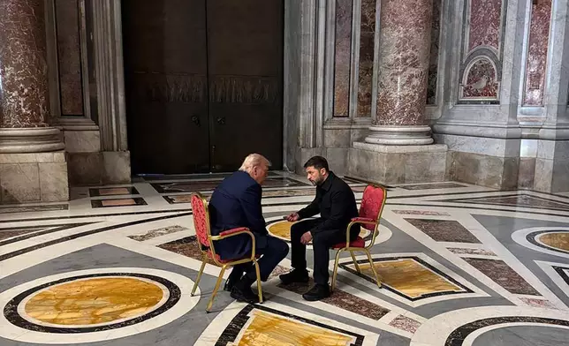 In this photo provided by the Ukrainian Presidential Press Office, Ukraine's President Volodymyr Zelenskyy, right, and President Donald Trump, talk as they attend the funeral of Pope Francis in Vatican, Saturday, April 26, 2025.(Ukrainian Presidential Press Office via AP)