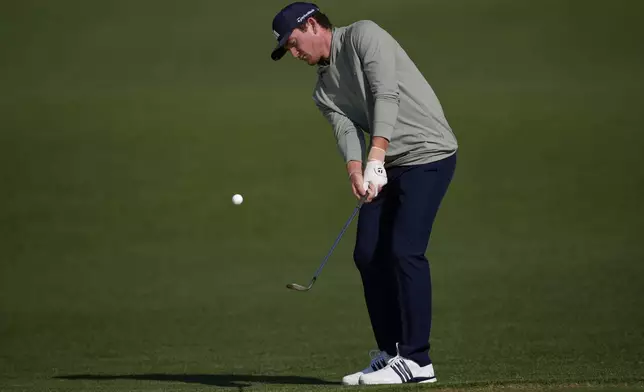 Nick Dunlap chips to the green on the second hole during the first round at the Masters golf tournament, Thursday, April 10, 2025, in Augusta, Ga. (AP Photo/George Walker IV)