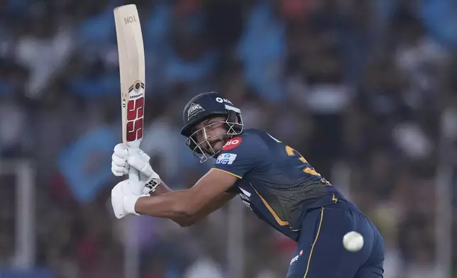Gujarat Titans' Shahrukh Khan plays a shot during the Indian Premier League cricket match between Gujarat Titans and Rajasthan Royals at Narendra Modi Stadium in Ahmedabad, India, Wednesday, April 9, 2025. (AP Photo/Ajit Solanki)