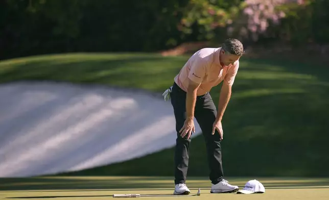 Justin Rose reacts after missing an eagle putt on the 13th hole during the final round at the Masters golf tournament, Sunday, April 13, 2025, in Augusta, Ga. (AP Photo/Julia Demaree Nikhinson)