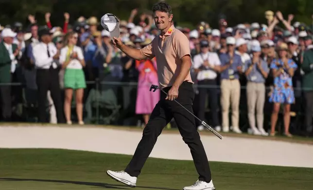Justin Rose celebrates after a birdie on the 18th hole during the final round at the Masters golf tournament, Sunday, April 13, 2025, in Augusta, Ga. (AP Photo/Matt Slocum)