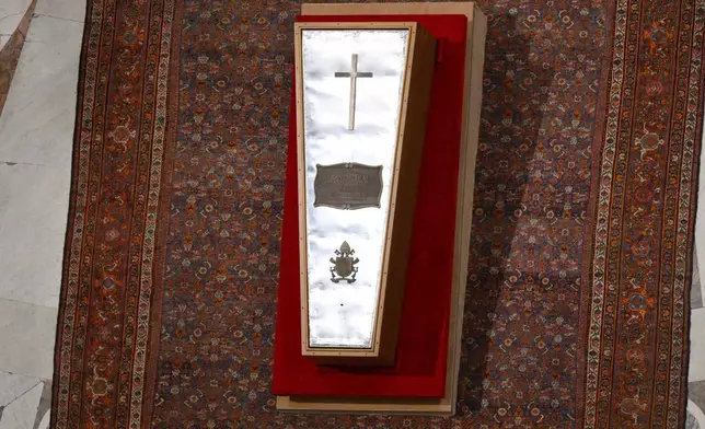 A zinc lid seals the body of late Pope Francis in his casket in St. Peter's Basilica at the Vatican Friday, April 25, 2025. (Vatican Media via AP)