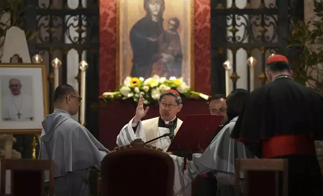 Cardinal Luis Antonio Gokim Tagle leads a rosary prayer outside the Santa Maria Maggiore Basilica, where the late Pope Francis will be buried, in Rome, Thursday, April 24, 2025. (AP Photo/Andreea Alexandru)