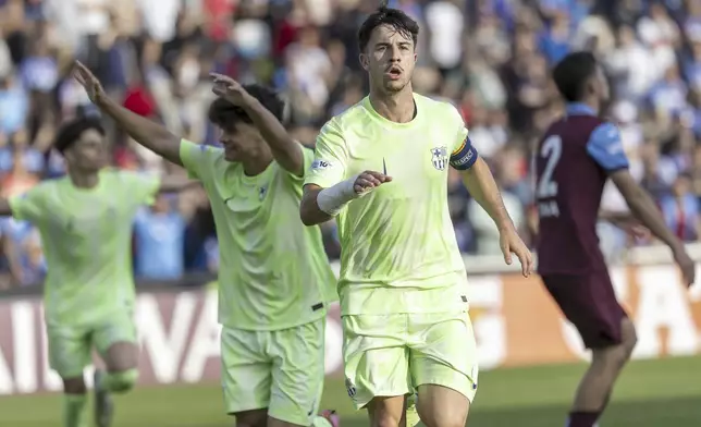 Barcelona's captain forward Hugo Alba celebrates after scoring, during the UEFA Youth League Final match between Trabzonspor and Barcelona, at the Colovray Sports Centre in Nyon, Switzerland, Monday, April 28, 2025. (Salvatore Di Nolfi/Keystone via AP)