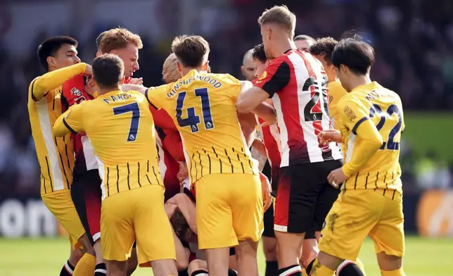 Tempers flare between the players, during the English Premier League soccer match between Brentford and Brighton and Hove Albion, at the Gtech Community Stadium, London, Saturday April 19, 2025. (Adam Davy/PA via AP)