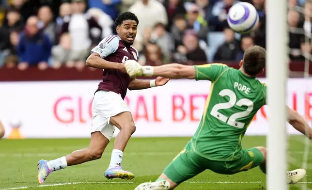 Aston Villa's Ian Maatsen scores past Newcastle United goalkeeper Nick Pope during the English Premier League soccer match between Aston Villa and Newcastle United at Villa Park, Birmingham, England, Saturday April 19, 2025. (Nick Potts/PA via AP)