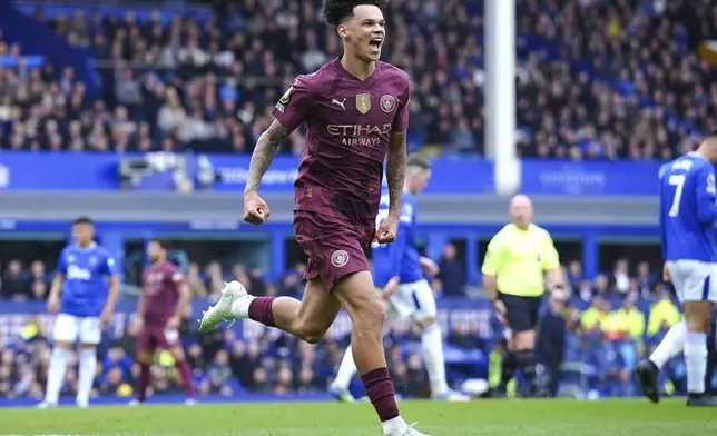 Manchester City's Nico O'Reilly celebrates scoring during the English Premier League soccer match between Everton and Manchester City at Goodison Park, Liverpool, England, Saturday April 19, 2025. (Peter Byrne/PA via AP)