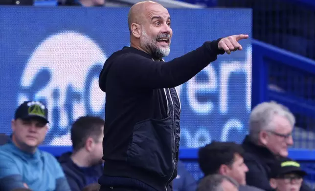 Manchester City manager Pep Guardiola gestures on the touchline during the English Premier League soccer match between Everton and Manchester City at Goodison Park, Liverpool, England, Saturday April 19, 2025. (Peter Byrne/PA via AP)