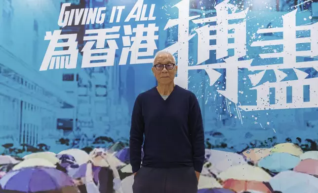 Yeung Sum, the founding member of the Democratic Party, poses for a photo at the Democratic Party's office in Prince Edward in Hong Kong on April 2, 2025. (AP Photo/May James)