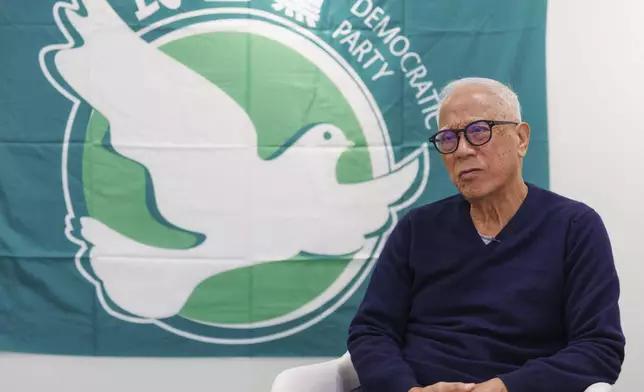 Yeung Sum, the founding member of the Democratic Party, is interviewed at the Democratic Party's office in Prince Edward in Hong Kong on April 2, 2025. (AP Photo/May James)