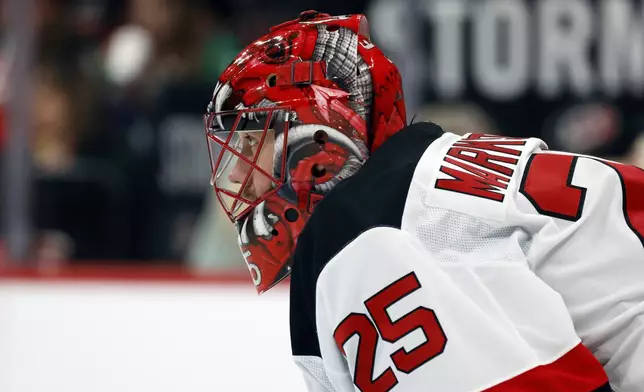 New Jersey Devils goaltender Jacob Markstrom (25) watches the puck against the Carolina Hurricanes during the second period of Game 2 of an NHL hockey Stanley Cup first-round playoff series in Raleigh, N.C., Tuesday, April 22, 2025. (AP Photo/Karl DeBlaker)