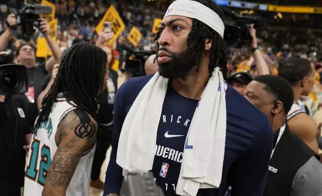 Dallas Mavericks forward Anthony Davis (3) walks off the court after the team's loss in an NBA play-in tournament basketball game against the Memphis Grizzlies, Friday, April 18, 2025, in Memphis, Tenn. (AP Photo/George Walker IV)