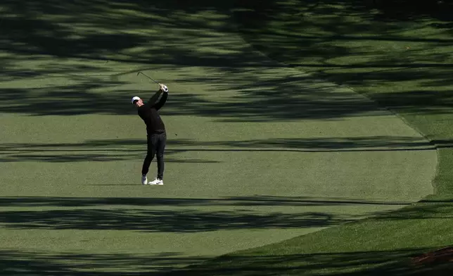 Rory McIlroy, of Northern Ireland, hits from the 10th fairway during a practice round at the Masters golf tournament, Tuesday, April 8, 2025, in Augusta, Ga. (AP Photo/Matt Slocum)