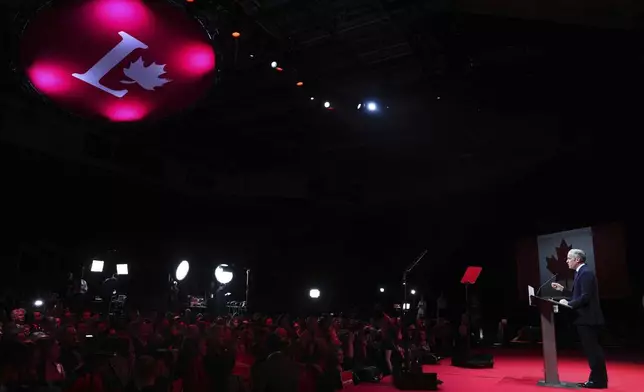 Canadian Prime Minister Mark Carney addresses supporters at his campaign headquarters after the Liberal Party won the Canadian election in Ottawa, Ontario, Tuesday, April 29, 2025. (Sean Kilpatrick/The Canadian Press via AP)
