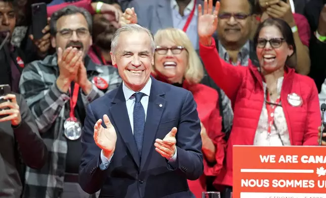 Canadian Prime Minister Mark Carney smiles on stage at his campaign headquarters after the Liberal Party won the Canadian election in Ottawa, Ontario, Tuesday, April 29, 2025. (Frank Gunn/The Canadian Press via AP)