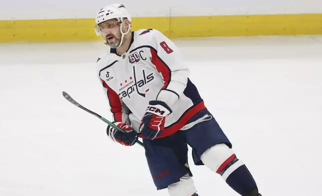 Washington Capitals left wing Alex Ovechkin (8) reacts after scoring a goal during the first period of an NHL hockey game against the Boston Bruins, Tuesday, April 1, 2025, in Boston. (AP Photo/Mark Stockwell)