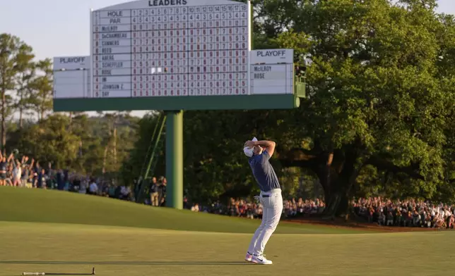 Rory McIlroy, of Northern Ireland, celebrates winning in a playoff against Justin Rose, of England, after the final round the Masters golf tournament, Sunday, April 13, 2025, in Augusta, Ga. (AP Photo/Julia Demaree Nikhinson)