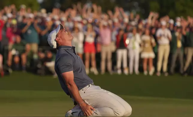 Rory McIlroy, of Northern Ireland, celebrates winning in a playoff against Justin Rose, of England, after the final round the Masters golf tournament, Sunday, April 13, 2025, in Augusta, Ga. (AP Photo/Matt Slocum)