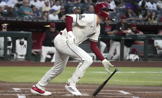 Arizona Diamondbacks' Pavin Smith hits a single against the Tampa Bay Rays in the first inning during a baseball game, Tuesday, April 22, 2025, in Phoenix. (AP Photo/Rick Scuteri)