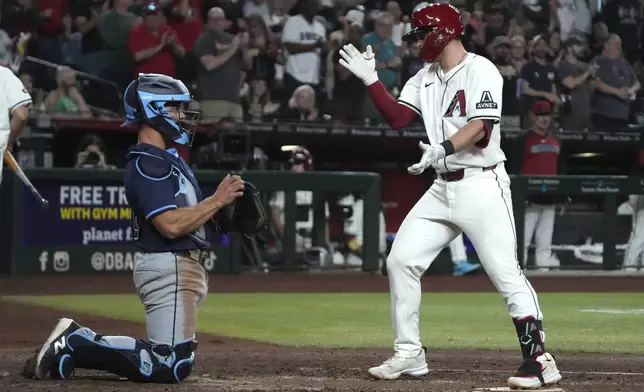 Arizona Diamondbacks' Tim Tawa reacts after hitting a solo home run against the Tampa Bay Rays in the fifth inning during a baseball game, Tuesday, April 22, 2025, in Phoenix. (AP Photo/Rick Scuteri)