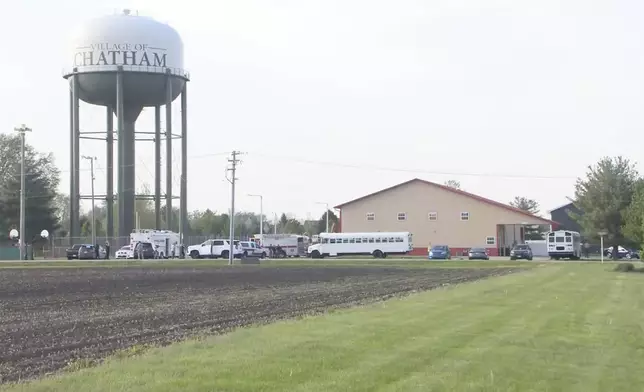This image taken from video provided by WCIA shows first responders working the scene after a car smashed through a building during an after-school program, killing multiple people Monday, April 28, 2025, in Chatham, Ill. (WCIA via AP)