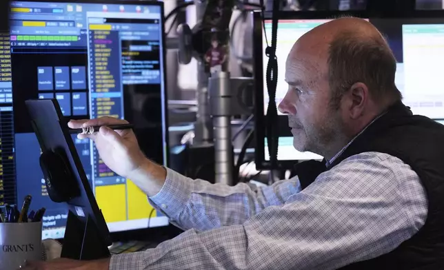 Trader Peter Mancuso works on the floor of the New York Stock Exchange, Tuesday, April 29, 2025. (AP Photo/Richard Drew)