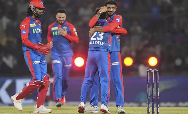 Delhi Capitals' Kuldeep Yadav (23) is congratulated by captain Axar Patel after taking the wicket of Rajasthan Royals' Yashasvi Jaiswal during the Indian Premier League cricket match between Delhi Capitals and Rajasthan Royals at Arun Jaitley Stadium in New Delhi, India, Wednesday, April 16, 2025. (AP Photo/Manish Swarup)