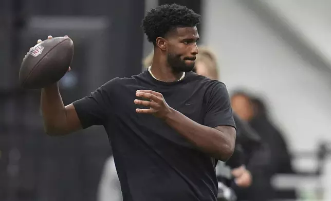 FILE - Colorado quarterback Shedeur Sanders (2) takes part in passing drills during Colorado's NFL football pro day Friday, April 4, 2025, in Boulder, Colo. (AP Photo/David Zalubowski,File)