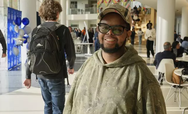 Case Western Reserve University student. Justen Pippens poses for a photo in the student union at the school In Cleveland Thursday, April 17, 2025. (AP Photo/Sue Ogrocki)
