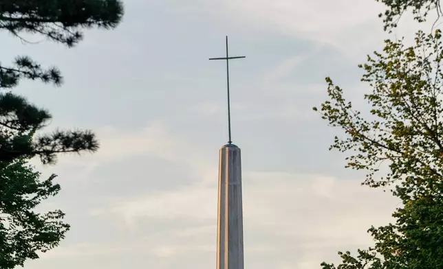 A cross sits atop the Archdiocese of Oklahoma City on Thursday, April 17, 2025 in Oklahoma City, Oklahoma. (AP Photo/Nick Oxford)